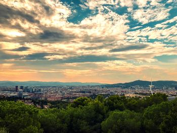 High angle view of buildings against sky during sunset