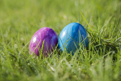 Close-up of easter egg on grassy field