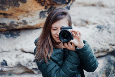 Portrait of woman photographing