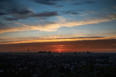 High angle view of buildings against sky during sunset