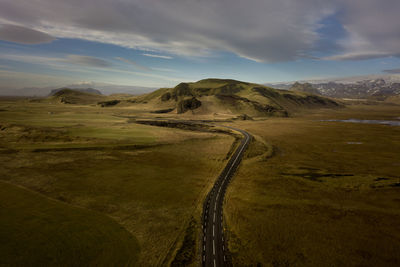 Aeril view of a car on a scenic road near vik, iceland