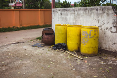 Garbage bin by wall