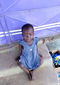 Young beautiful girl sitting down and looking at camera for a self picture. 