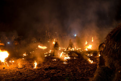 Panoramic view of bonfire at night