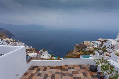 Panorama of the village of oia and the caldera on a rare rainy day, santorini, greece