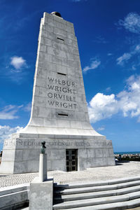 Low angle view of statue against sky