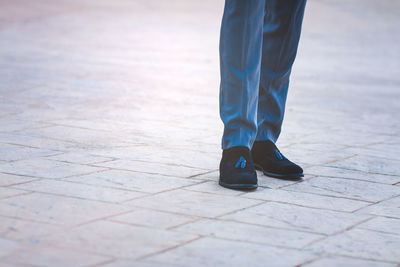 Low section of woman standing on floor