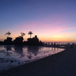 Scenic view of beach against sky during sunset