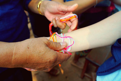 High angle view of people holding hands