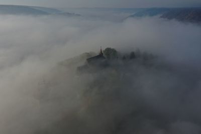 Scenic view of cloudscape over mountain