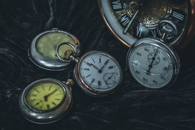 High angle view of clock on table