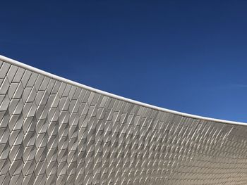 Low angle view of building against clear blue sky