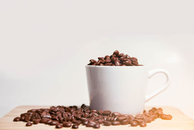 Close-up of coffee beans on table