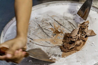 High angle view of person preparing food on table