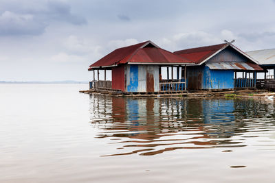 House by sea against sky