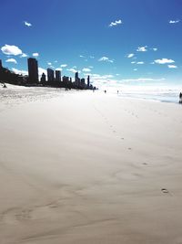 View of beach against blue sky