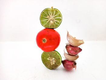 High angle view of fruits against white background