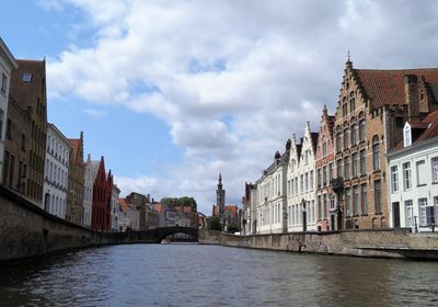 Canal amidst buildings in city