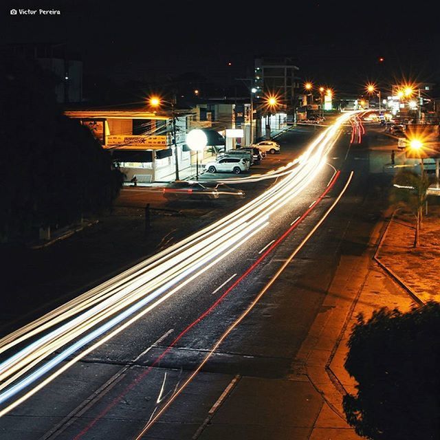 night, illuminated, street light, transportation, street, light trail, road, city, building exterior, lighting equipment, long exposure, speed, motion, built structure, the way forward, architecture, light - natural phenomenon, car, city street, high angle view