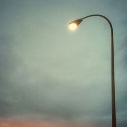 Low angle view of street light against sky