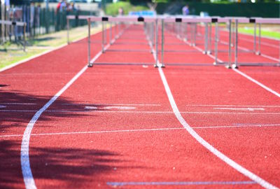 High angle view of hurdles on running track