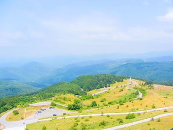 Scenic view of landscape and mountains against sky