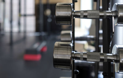 Close-up of dumbbells in gym