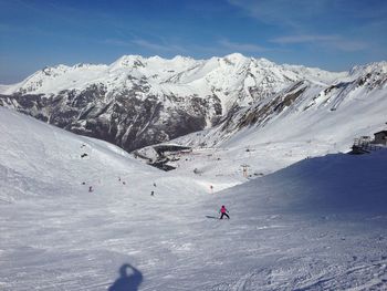 People skiing on snow mountain. pyrenees mountain between spain and france