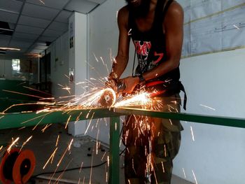 Mid section of welder at work