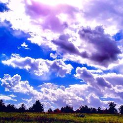 Scenic view of landscape against cloudy sky