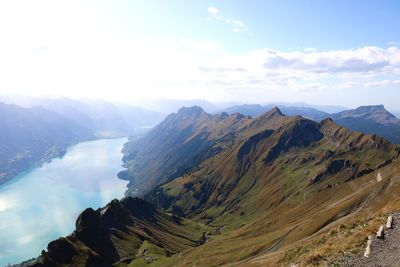 Scenic view of mountains against cloudy sky