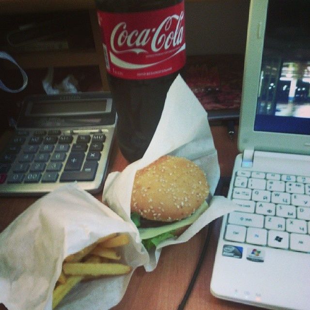 indoors, communication, food and drink, text, table, food, western script, close-up, still life, freshness, book, paper, person, laptop, wireless technology, holding, focus on foreground, technology