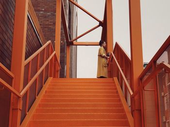 Low angle view of staircase in building against sky