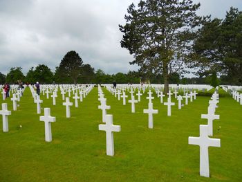 Row of cemetery against sky