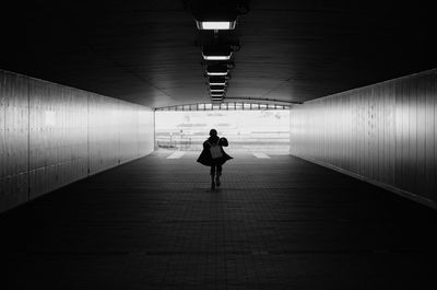 People walking in tunnel