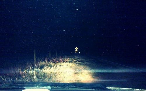 Scenic view of sea against sky at night