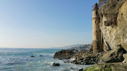 Tranquil view of coastline against sky