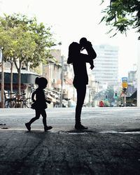 People walking on street in city