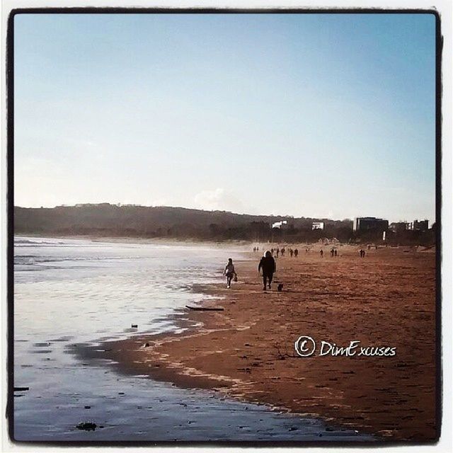 water, transfer print, beach, clear sky, sea, auto post production filter, scenics, tranquil scene, tranquility, men, shore, nature, beauty in nature, leisure activity, sky, sand, copy space, lifestyles, walking