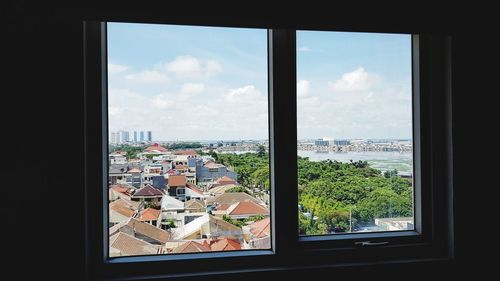 City seen through glass window