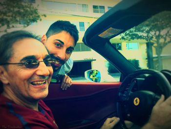 Portrait of smiling man in car