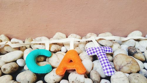 High angle view of toys on pebbles