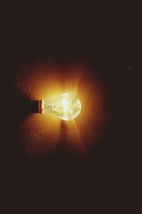 Close-up of illuminated light bulb