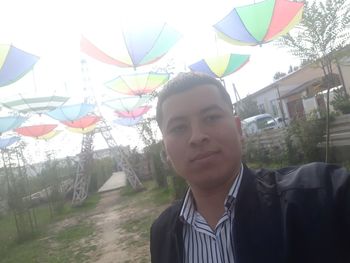 Portrait of young man standing outdoors