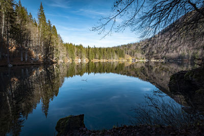 Relective lake with blue sky and crystal clear water