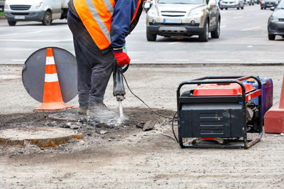 Man working at construction site in city