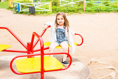 Portrait of girl playing at playground