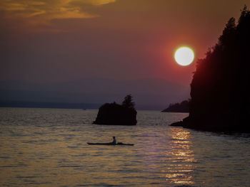 Scenic view of sea at sunset