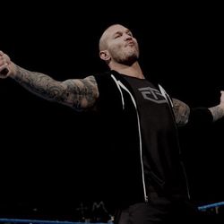 Low angle view of man standing against black background