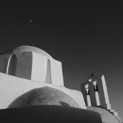 Low angle view of cross against clear sky